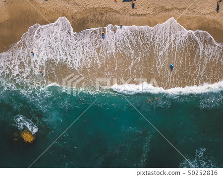 Beach with sun loungers on the coast of the ocean Beach with sun loungers on the coast of the ocean 50252816