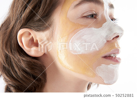 Side view of pretty woman with face mask 50252881