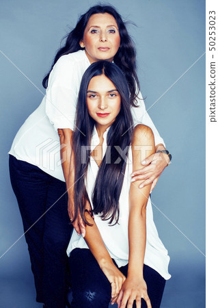 cute pretty teen daughter with mature mother hugging, fashion style brunette, lifestyle people cute pretty teen daughter with mature mother hugging, fashion style brunette, lifestyle people 50253023