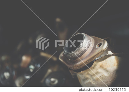 Disassembled car engine and muffler at garage Disassembled car engine and muffler at garage 50259553