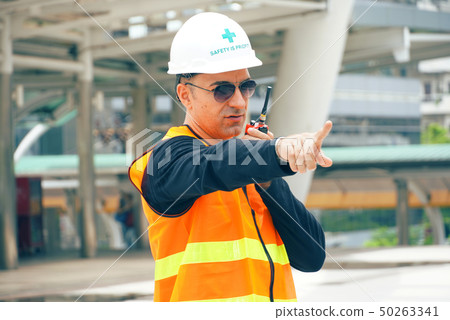 Engineer wear helmet and use radio communication Engineer wear helmet and use radio communication 50263341