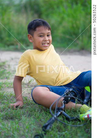 asian kid boy have accident when ride bicycle asian kid boy have accident when ride bicycle 50263522