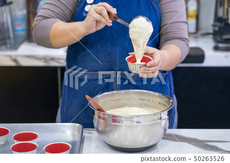 woman making cake in the room 50263526