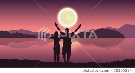 happy couple with arms raised enjoy the full moon and mountain landscape by the lake happy couple with arms raised enjoy the full moon and mountain landscape by the lake 50265854