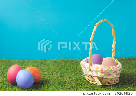 Easter eggs in a basket weave wood on the green Easter eggs in a basket weave wood on the green 50266926