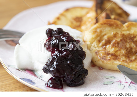 Drained yogurt and blueberry jam 50268435