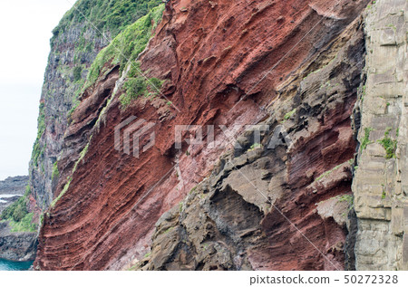 The red wall in front of the island Oki Island in Geopark 50272328