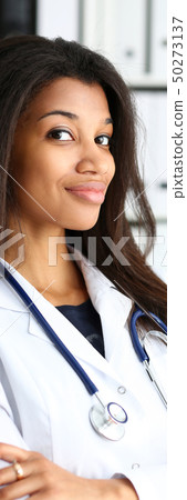 Beautiful black smiling female doctor portrait Beautiful black smiling female doctor portrait 50273137