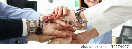 Group of people in suits crossed hands Group of people in suits crossed hands 50274027