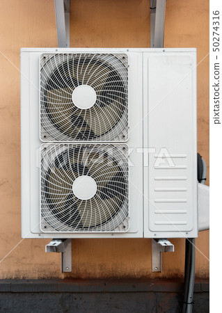 Close-up of Industrial cooling machine with two fans on the wall Close-up of Industrial cooling machine with two fans on the wall 50274316