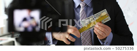 Male in suit and tie show stats graph pad 50275336