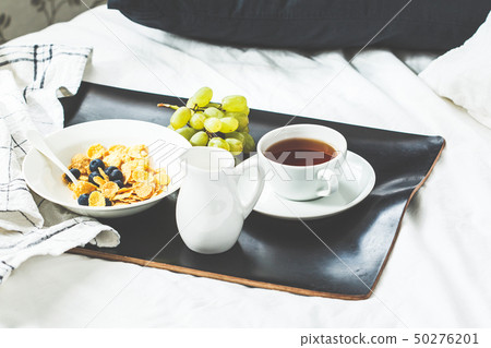 Breakfast in bed. Cornflakes with berries Breakfast in bed. Cornflakes with berries 50276201