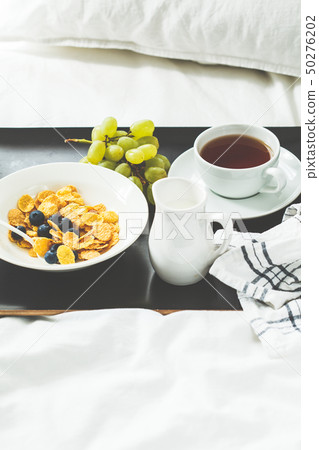Breakfast in bed. Cornflakes with berries  50276202