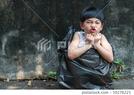 Little girl is acting in garbage bag Little girl is acting in garbage bag 50276225