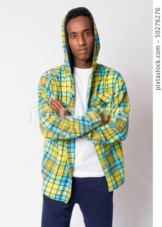 Young handsome African hipster man wearing hoodie with arms crossed Young handsome African hipster man wearing hoodie with arms crossed 50276276