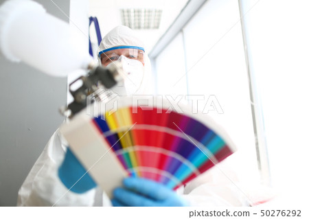 Handyman portrait olding airbrush and colorful fantail Handyman portrait olding airbrush and colorful fantail 50276292