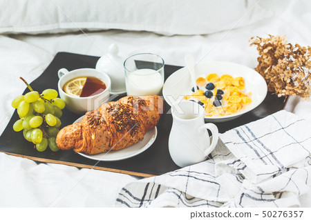 Continental breakfast in bed.  50276357