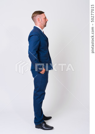 Full body shot of blonde businessman wearing blue suit Full body shot of blonde businessman wearing blue suit 50277015
