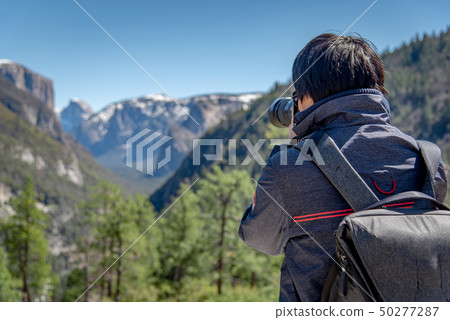 Tourist taking photo in Yosemite national park 50277287