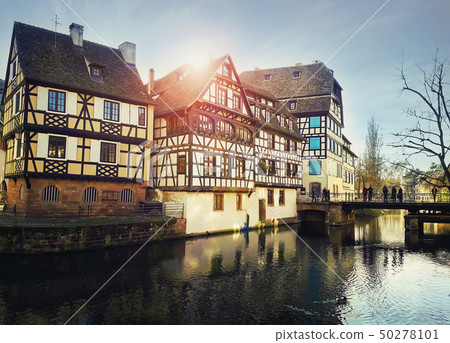Traditional timbered houses near the river. 50278101