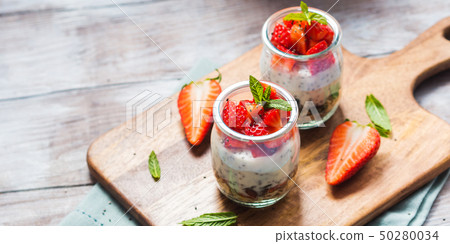 Yogurt and granola with strawberries. Breakfast Yogurt and granola with strawberries. Breakfast 50280034