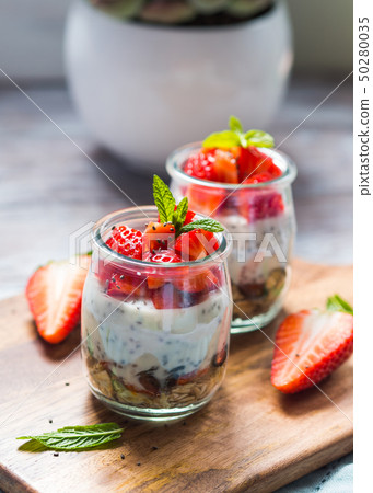 Yogurt and granola with strawberries. Breakfast 50280035
