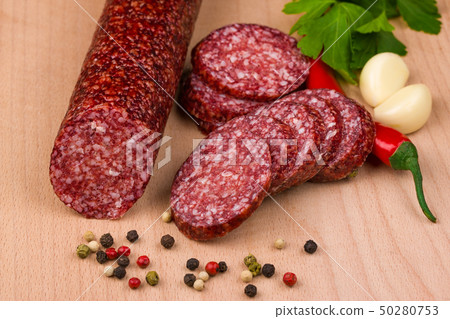 salami sausages on a wooden table salami sausages on a wooden table 50280753