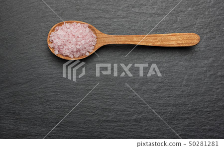 pink Himalayan salt on wooden spoon pink Himalayan salt on wooden spoon 50281281