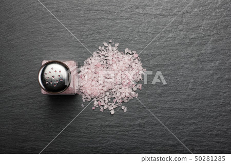 salt shaker with pink Himalayan salt on black salt shaker with pink Himalayan salt on black 50281285