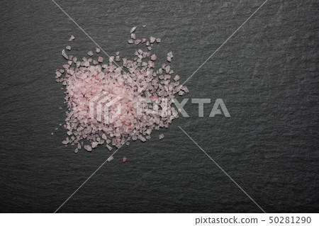 Pink Himalayan salt on black background Pink Himalayan salt on black background 50281290