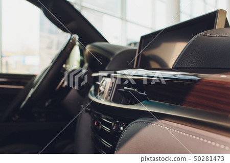 Dark luxury car Interior - steering wheel, shift lever and dashboard. Dark luxury car Interior - steering wheel, shift lever and dashboard. 50281473