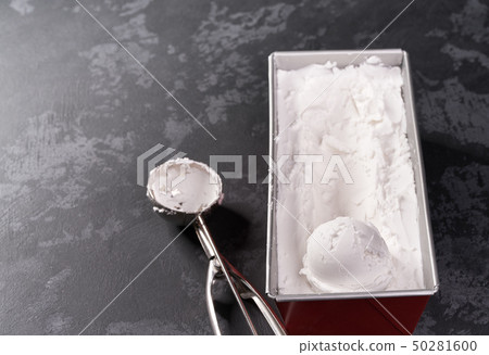 Metal spoon of vanilla ice cream on black Metal spoon of vanilla ice cream on black 50281600