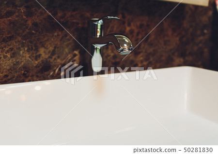 Bathroom interior with white sink and faucet. Bathroom interior with white sink and faucet. 50281830