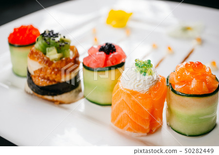 Set of Japanese delicacy, sushi rolls on slate Set of Japanese delicacy, sushi rolls on slate 50282449