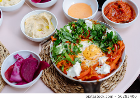 Shakshuka, Fried Eggs in Tomato Sauce on the Table 50283400