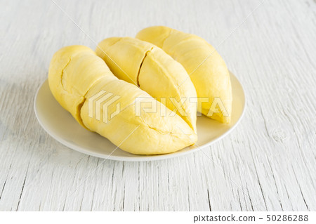 Durian is asian fruit have yellow and smelly . Durian is asian fruit have yellow and smelly . 50286288