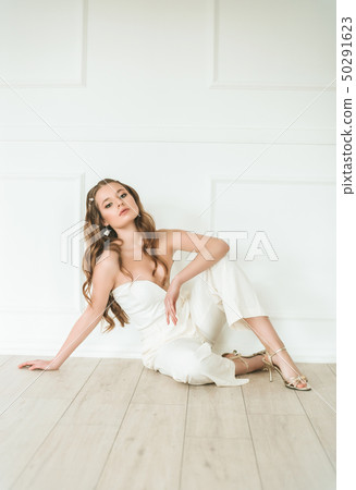 Beautiful young bride in a white dress  50291623