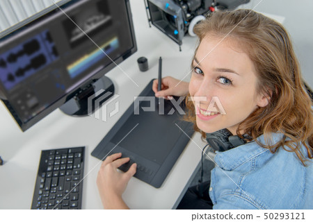 young woman designer using graphics tablet for 50293121