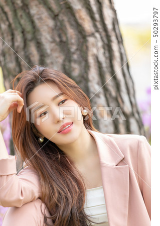 Woman relaxing in the park Woman relaxing in the park 50293797