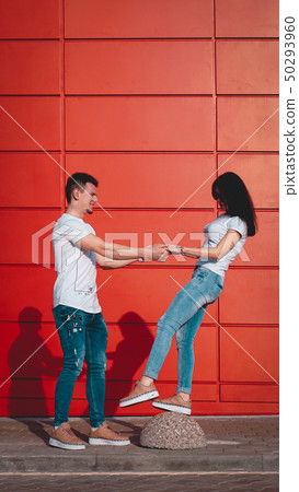 Young smiling couple in love, man holding attractive woman hand 50293960