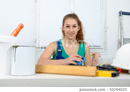 Woman doing DIY work at home Woman doing DIY work at home 50294033