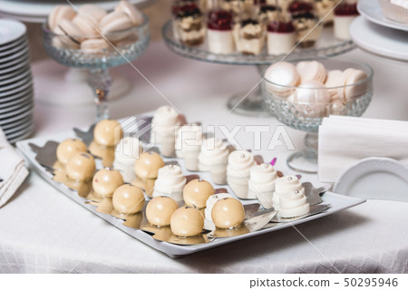 white Cakes and cupcakes on vintage white dish white Cakes and cupcakes on vintage white dish 50295946