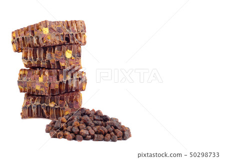 Bee bread granules and a piece of honey cells are Bee bread granules and a piece of honey cells are 50298733