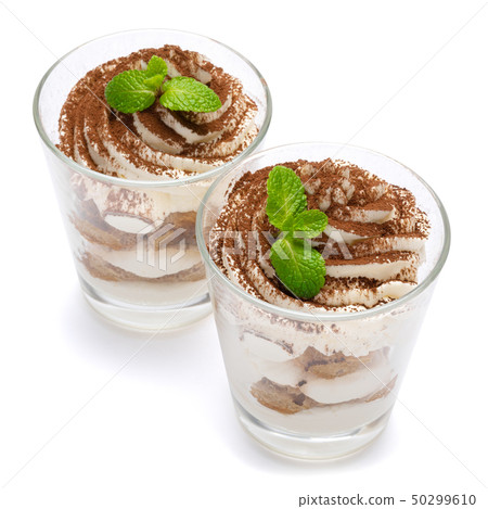 two portions Classic tiramisu dessert in a glass isolated on a white background with clipping path two portions Classic tiramisu dessert in a glass isolated on a white background with clipping path 50299610