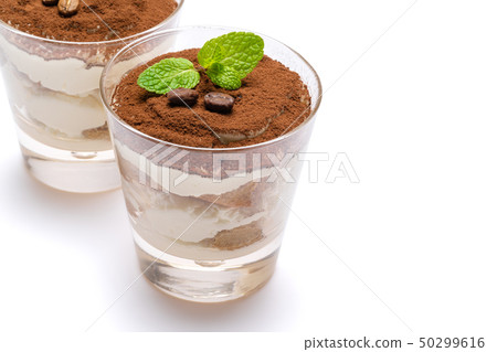 two portions Classic tiramisu dessert in a glass isolated on a white background with clipping path two portions Classic tiramisu dessert in a glass isolated on a white background with clipping path 50299616