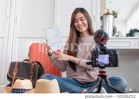 Asian young female blogger recording vlog video 50300252