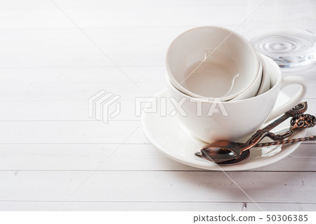 Clean dishes on table on white background. Clean dishes on table on white background. 50306385