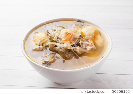 Soup of sauerkraut, meat stock in the dish. 50306393