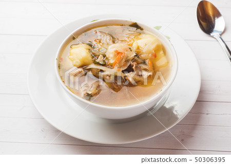 Soup of sauerkraut, meat stock in the dish. 50306395