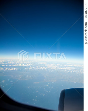 Blue sky and engine. View from airplane flying in Blue sky and engine. View from airplane flying in 50307208